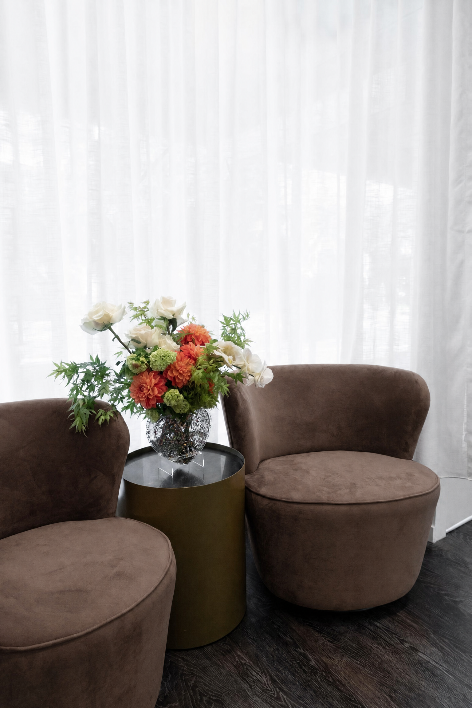 Waiting area with brown chairs at Mia Thomas Aesthetics in Woollahra